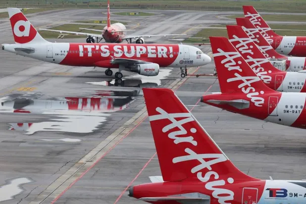 AirAsia planes stand on the tarmac at Kuala Lumpur International Airport Terminal 2 (KLIA2) in Sepang, Malaysia, January 21, 2026. (Reuters) 