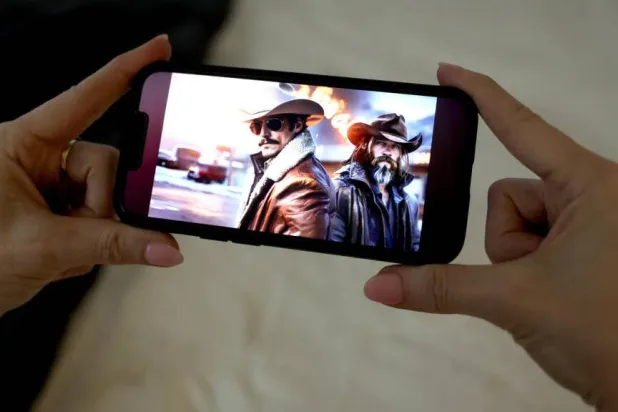 "Whiskey & Water," a song by Cain Walker featuring Cade Winslow, is one of many AI-generated country music tunes. TIMOTHY A. CLARY / AFP
