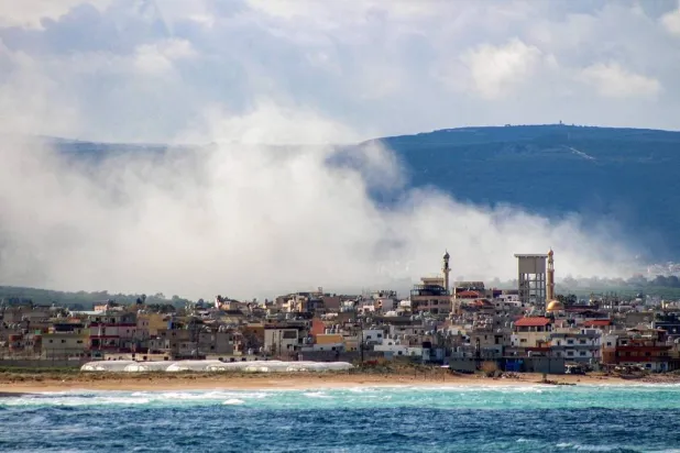 Smoke rises following Israeli bombardment on the village of Qlaile as pictured from nearby Tyre in southern Lebanon on April 7, 2026. (AFP)