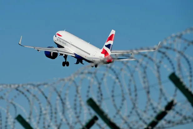 A British Airways plane takes off from Milan Linate airport northern Italy, on April 7, 2026. (Photo by Stefano RELLANDINI / AFP)
