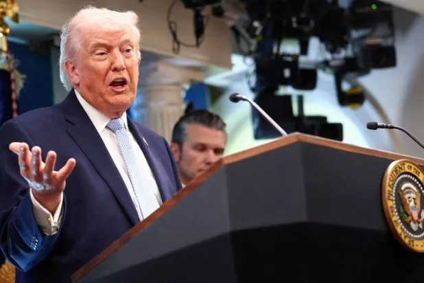 US President Donald Trump, flanked by Secretary of Defense Pete Hegseth, speaks during a press conference in the James S. Brady Press Briefing Room at the White House in Washington, DC, US, April 6, 2026. (Reuters)