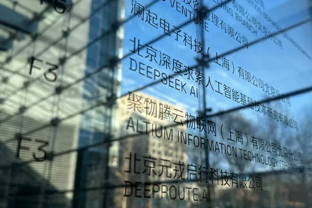 (FILES) Floor signage for the offices of DeepSeek (C) is seen in Beijing on January 28, 2025. (Photo by PETER CATTERALL / AFP)