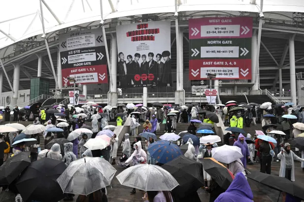 BTS fans arrive at a stadium where K-pop boy band BTS will perform in Goyang on April 9, 2026. (AFP)