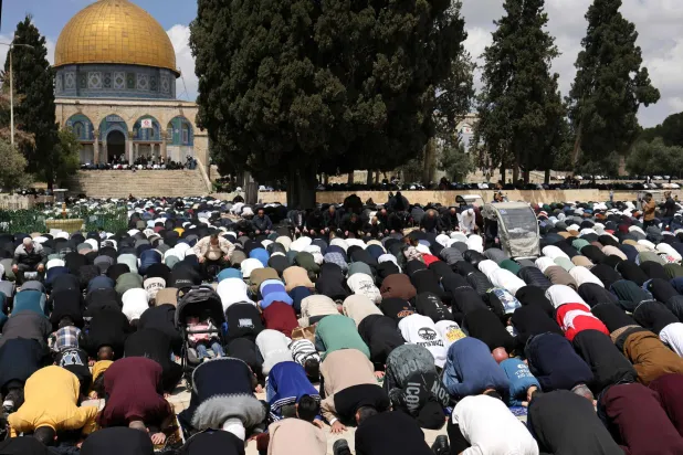 Muslim worshippers pray outside the Dome of the Rock at the Al-Aqsa Mosque compound during Friday noon prayers, following 40 days of closure by the Israeli authorities, in Jerusalem's Old City on April 10, 2026. (AFP)