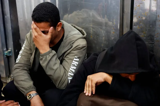 Mourners react during the funeral of Palestinians who were killed in an Israeli strike, according to medics, at Al-Aqsa Martyrs Hospital in Deir al-Balah, central Gaza Strip, April 11, 2026. REUTERS/Mahmoud Issa