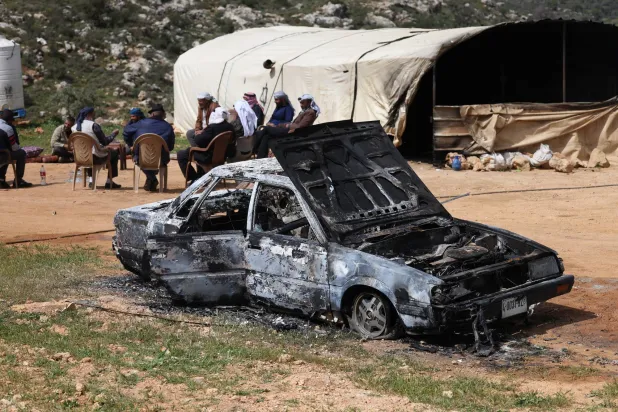 A damaged car in the Wadi Al-Lubban Al-Shamali area, south of Nablus, 06 April 2026. Israeli settlers burned a house, two tents, and three vehicles, and assaulted Palestinians in the town of Al-Lubban Ash-Sharqiya earlier in the day. (EPA)