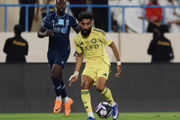 نواف بوشل خلال المواجهة أمام الأخدود (موقع النادي)