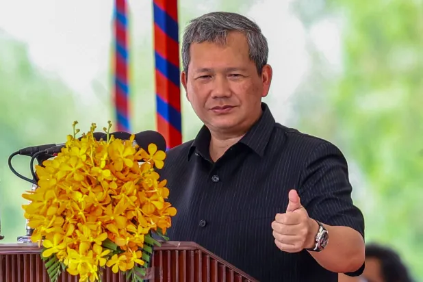 This handout photo taken and released by Agence Kampuchea Press (AKP) on April 11, 2026 shows Cambodia's Prime Minister Hun Manet speaking in Takeo province. (Photo by Handout / Agence Kampuchea Press (AKP) / AFP) 