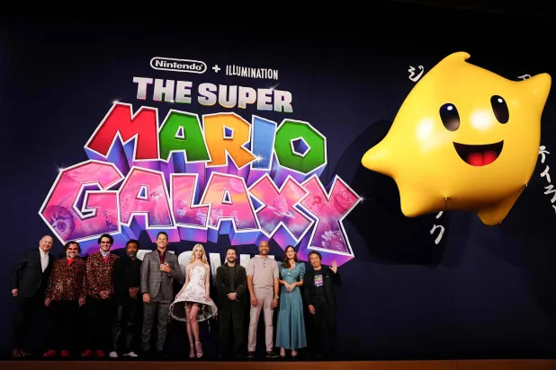 (FILES) (L-R) American actors Chris Meledandri, Jack Black, Benny Safdie, Donald Glover, Chris Pratt, Anya Taylor Joy, Charlie Day, Keegan-Michael Key, Brie Larson and Shigeru Miyamoto attend the world premiere of 'The Super Mario Galaxy Movie' at Minamiza Theater in Kyoto on March 28, 2026. (Photo by Yuichi YAMAZAKI / AFP)