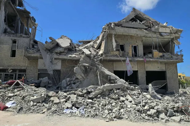 A destroyed building is pictured at the site of an Israeli strike that targeted the southern Lebanese village of Al-Bazouriyah, on April 12, 2026. (AFP)