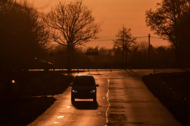 A car drives along a road during sunset near Berlin, Germany, 09 April 2026, a few days after Iran and the US announced a two-week conditional ceasefire to halt military operations. (EPA)