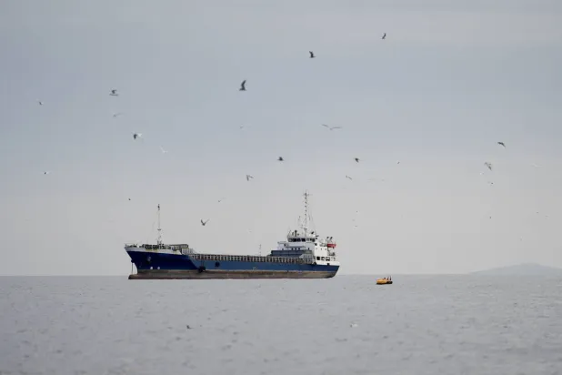 A vessel at the Strait of Hormuz, off the coast of Oman’s Musandam province, April 12, 2026. (Reuters)