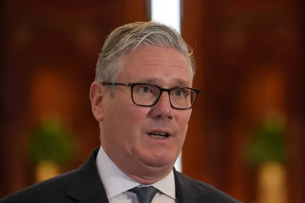 Britain's Prime Minister Keir Starmer speaks to the media at the airport in Doha, Qatar, Friday, April 10, 2026 after his three-day visit to the Gulf region.(AP Photo/Alastair Grant, Pool)