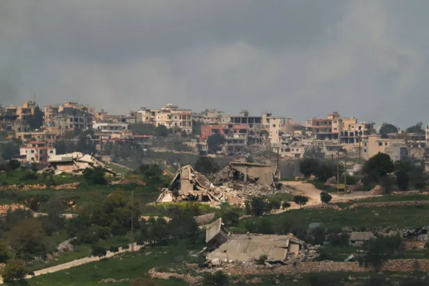 Destroyed buildings in Bint Jbeil, southern Lebanon, near the Israel-Lebanon border, as seen from the Israeli side of the border in northern Israel, April 13, 2026. REUTERS/Florion Goga