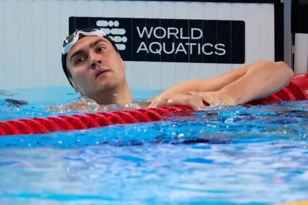 Neutral Athlete Russia, Kliment Kolesnikov reacts after winning gold medal in the men’s 50-meter backstroke final at the World Aquatics Championships in Singapore, on Aug. 3, 2025. (AP Photo/Vincent Thian, File)

