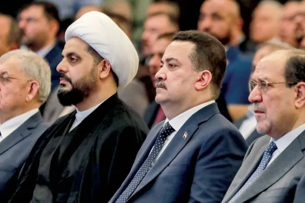 Sudani, Maliki ve Hazali, Bağdat'ta düzenlenen bir toplantıda (Arşiv-AFP)