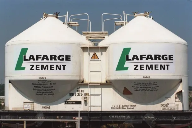 13 July 1995, Saxony-Anhalt, Karsdorf: French cement manufacturer Lafarge logo pictured in Karsdorf on railroad containers. (dpa)