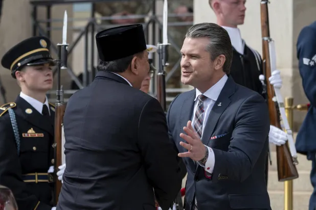 Defense Secretary Pete Hegseth, right, welcomes Minister of Defense for Indonesia Sjafrie Sjamsoeddin to the Pentagon, Monday, April 13, 2026 in Washington. (AP Photo/Kevin Wolf)
