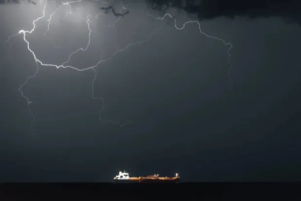 Lightning occurs when META 4, an Oil Products Tanker, sails into Muscat Anchorage on March 21, 2026 at Sultan Qaboos Port in Muscat, Oman (Getty)