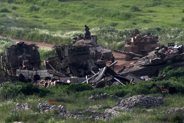  Israeli military armored vehicles operate in Lebanon, near the Israel-Lebanon border, as seen from the Israeli side of the border in northern Israel, April 14, 2026. (Reuters)