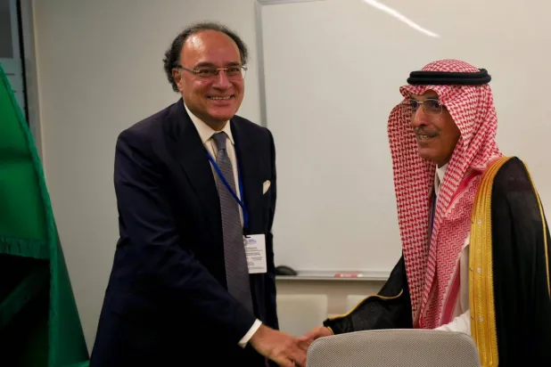 Saudi Finance Minister Mohammed Al-Jadaan and Pakistani Finance Minister Muhammad Aurangzeb shake hands following the agreement. (X)