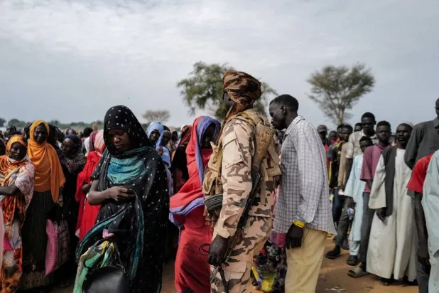 Sudanese refugees, who have fled the violence in their country, line up to receive food rations from World Food Program (WFP), in Adre Chad July 20, 2023. (Reuters)