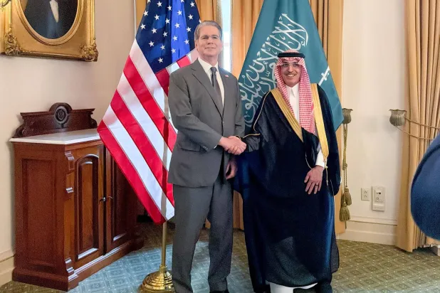 Al-Jadaan and Bessent shake hands after signing the Tax Information Exchange Agreement in Washington. (X)