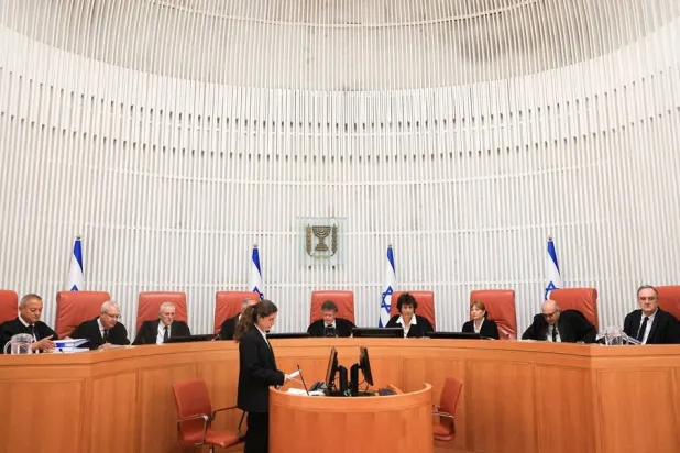 Israeli Supreme Court judges assemble on the day of the hearing for a petition to force Israeli Prime Minister Benjamin Netanyahu to oust Israeli National Security Minister Itamar Ben-Gvir from his position, following allegations Ben-Gvir used his role to intervene in investigations and operational matters, at the Supreme Court in Jerusalem April 15, 2026. (Reuters) 
