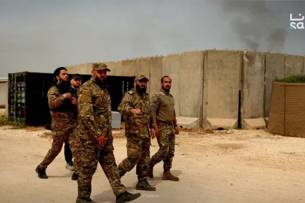 A photo released by Syria’s state news agency SANA shows the army as it takes control of the base (SANA).