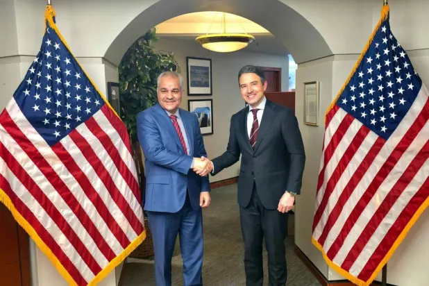 Libya central bank governor (left) with US assistant secretary of state (central bank)