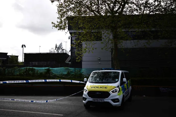 A Police van is parked outside of a warehouse park housing offices of a the Persian-language TV station, Iran International, in Wembley, northwest London on April 16, 2026. (Photo by Henry NICHOLLS / AFP)