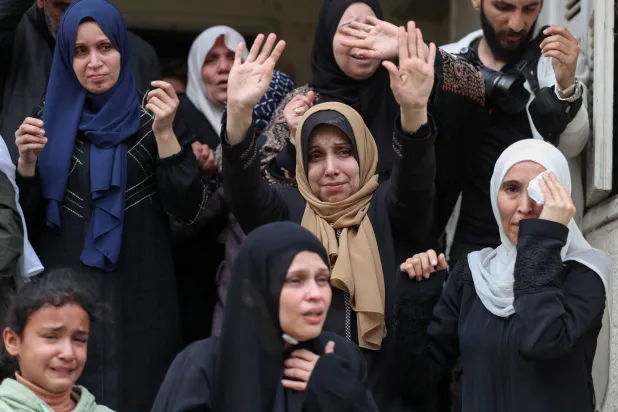 Mourners react during the funeral of Palestinians who were killed in an Israeli strike that took place on Tuesday, according to medics, at Al-Shati camp in Gaza City, April 15, 2026. REUTERS/Dawoud Abu Alkas