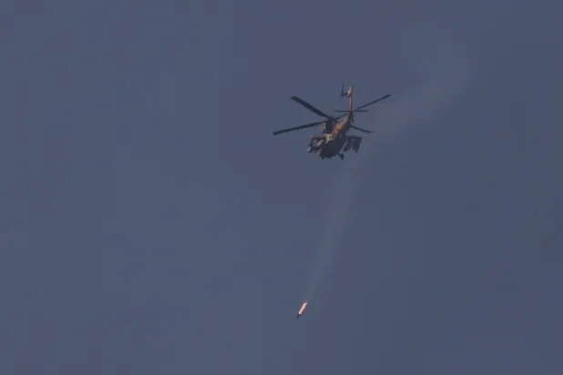  An Israeli helicopter fires a projectile, as it flies over Lebanon, after a 10-day ceasefire between Lebanon and Israel went into effect, as seen from Israel, April 17, 2026. (Reuters)