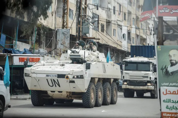 A UNIFIL convoy rides through the town, as seen through the window of a vehicle, in Tyre, south Lebanon, April 15, 2026. REUTERS/Louisa Gouliamaki