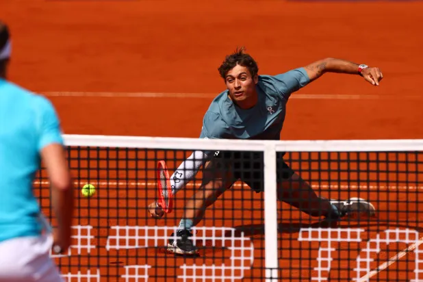 Flavio Cobolli of Italy in action during his semi-finals match against Alexander Zverev of Germany at the BMW Open tennis tournament in Munich, Germany, 18 April 2026.  EPA/ANNA SZILAGYI