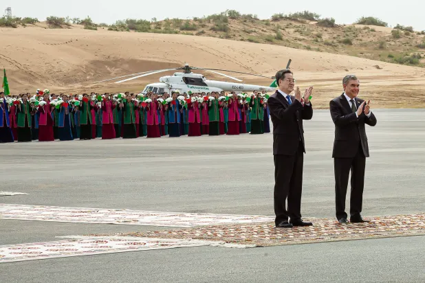 Former Turkmen president Gurbanguly Berdymukhamedov and Chinese Vice Premier Ding Xuexiang applaud during a ceremony launching the fourth of seven planned development phases at Galkynysh gas field, the world's second-largest gas field in the Karakum desert about 400 kilometres (250 miles) east of the capital Ashgabat, on April 17, 2026. (Photo by AFP)