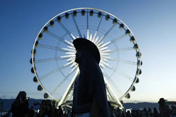A festivalgoer looks on during day two of weekend two at the 2026 Coachella Valley Music and Arts Festival at the Empire Polo Club in Indio, California, USA, 18 April 2026. (EPA)