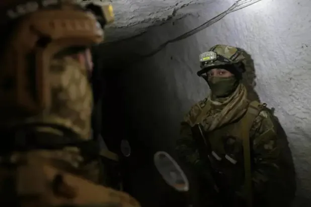  Syrian soldiers inspect a tunnel on the Lebanon border in the Qusayr area. (AFP)