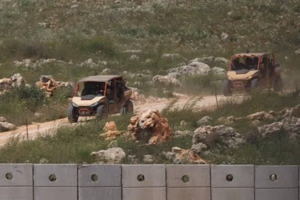  Israeli military vehicles drive in southern Lebanon, near the Israel-Lebanon border, amid a 10-day ceasefire between Lebanon and Israel, as seen from Israel, April 19, 2026. (Reuters)