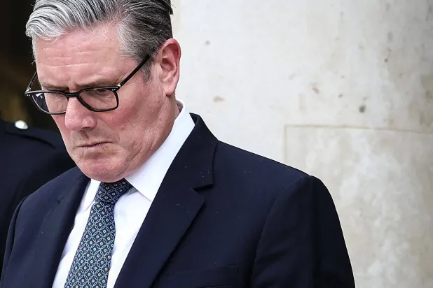 Britain's Prime Minister Keir Starmer reacts as he prepares to leave the Elysee Presidential Palace in Paris on April 17, 2026 following an international summit on efforts to reopen the Strait of Hormuz. (AFP)