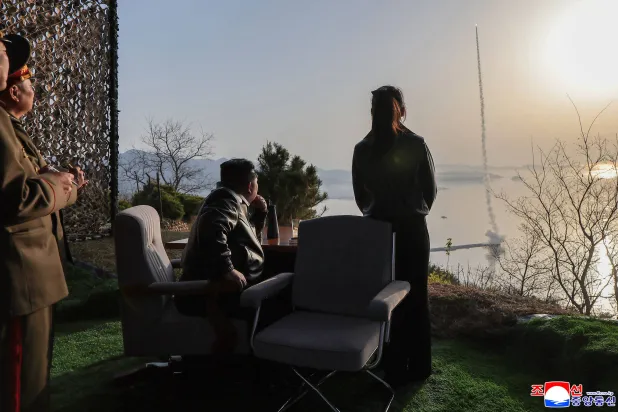 This picture taken on April 19, 2026 and released by North Korea's official Korean Central News Agency (KCNA) on April 20, 2026 shows North Korean leader Kim Jong Un (L) and his daughter Kim Ju Ae (R) inspecting the test-fire of a ballistic missile at an undisclosed location in North Korea. (KCNA via KNS / AFP) 