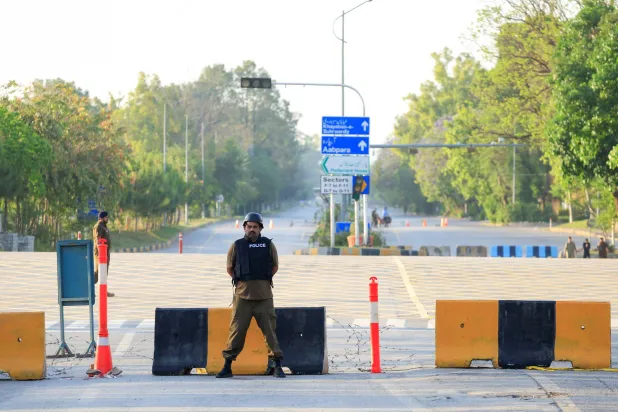  Police officers stand guard on a road leading to the Serena Hotel, as Pakistan prepares to host the US and Iran for the second phase of peace talks in Islamabad, Pakistan, April 21, 2026. (Reuters)