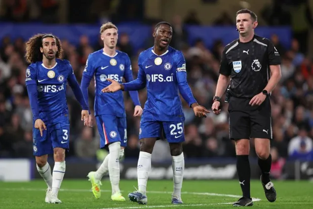 Football - Premier League - Chelsea v Manchester United - Stamford Bridge, London, Britain - April 18, 2026 Chelsea's Marc Cucurella and Moises Caicedo react. (Reuters)