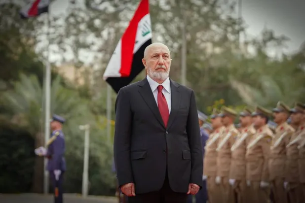  In this photo released by official website of the Iraqi Presidency Office, newly elected President Nizar Amidi inspects an honor guard during his ceremonial reception at the Peace Palace in Baghdad, Sunday, April 12, 2026. (Iraqi Presidency Office via AP) 