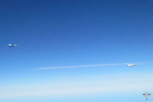  In this photo, provided by the French Army on Monday, April 20, 2026, a Russian supersonic Tu-22M3 strategic bomber, right, and an escorting Su-35 Russian fighter jet fly together over the Baltic Sea. (Etat-Major des Armees via AP) 