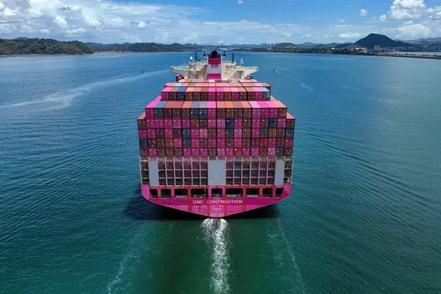 Aerial view of the One Contribution container ship sailing under the Tokio flag as it enters the Panama Canal in Panama City on April 21, 2026. (EPA)