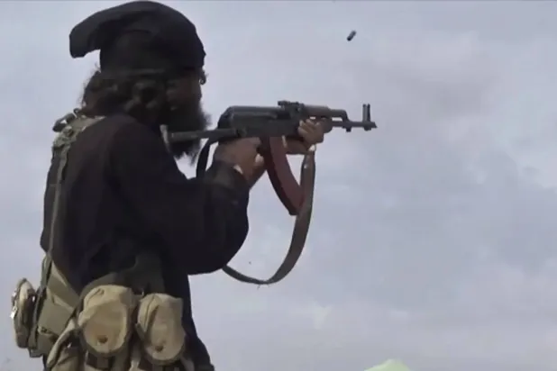An ISIS fighter in Baghouz, Syria, in 2019, in a photo released by the group’s Amaq agency (AP)