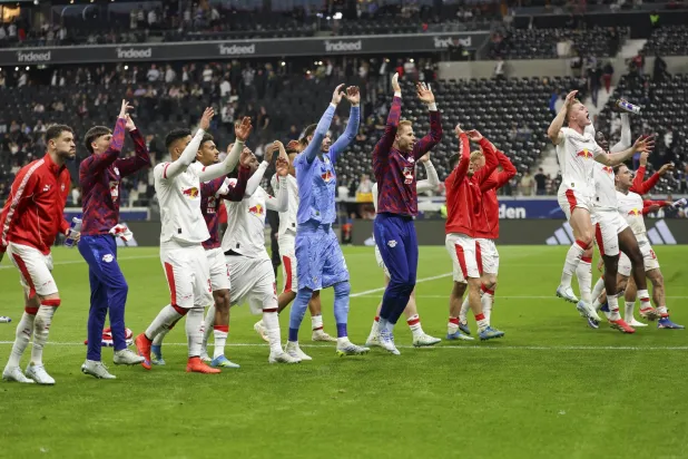 Players of RB Leipzig celebrate with their supporters after winning the German Bundesliga soccer match between Eintracht Frankfurt and RB Leipzig in Frankfurt, Germany, 18 April 2026. EPA/CHRISTOPHER NEUNDORF