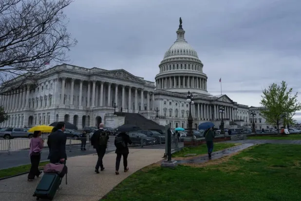 Passersby near the United States Capitol (Reuters)