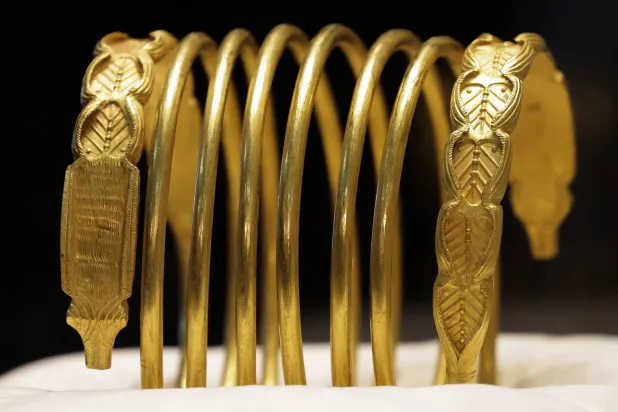 One of two gold bracelets is displayed during a media presentation at the National History Museum of Romania in Bucharest, Romania, 21 April 2026.EPA/ROBERT GHEMENT